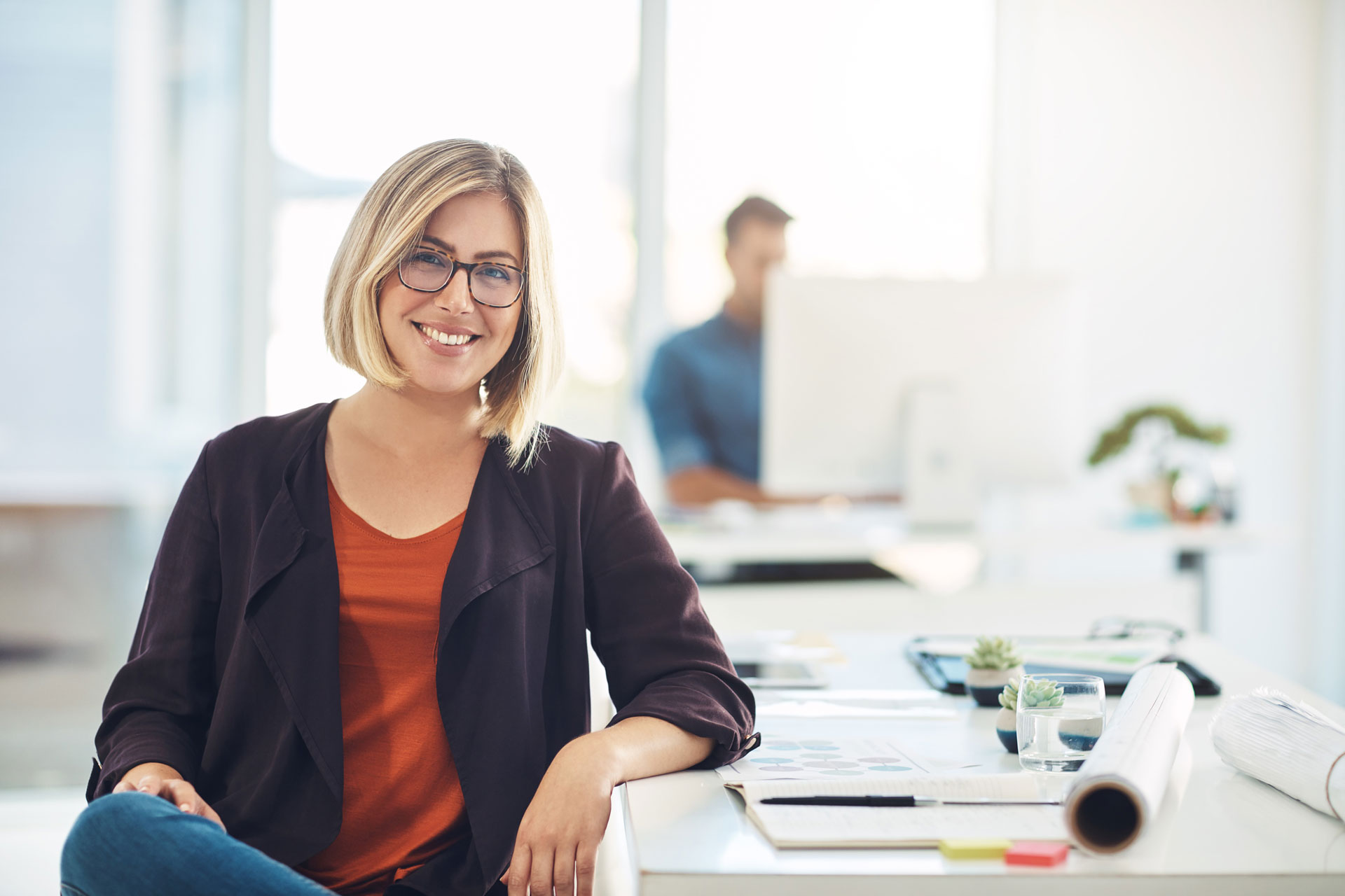a professional woman smiling in an office setting